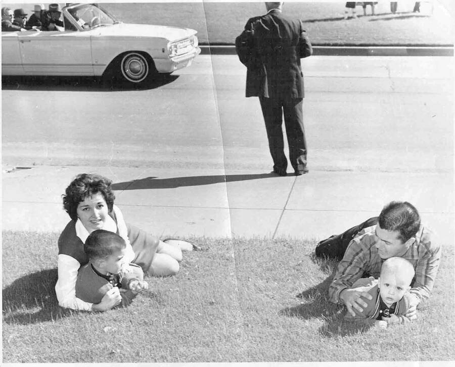 Bill and Gayle Newman fell on the grass sheltering their children, north of Elm Street seconds after the assassination of U.S. President Joh