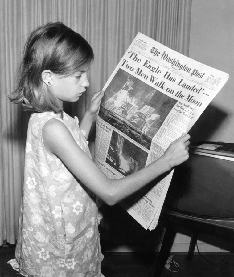 This is a picture of my mother holding The Washington Post newspaper on Monday, July 21, 1969 stating ' The Eagle Has Landed. Two Men
